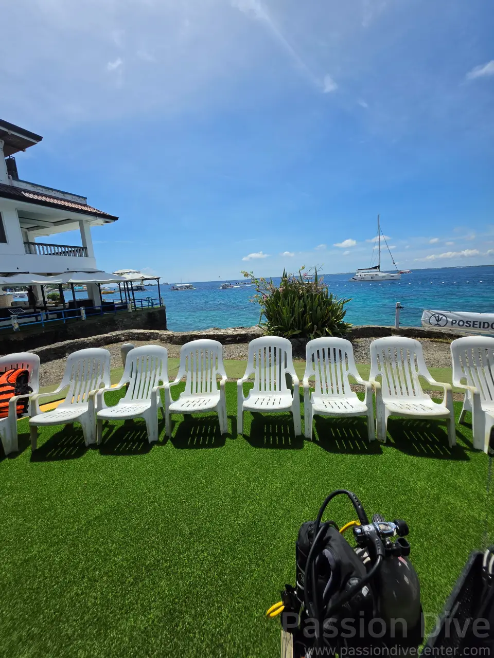 Scenic ocean view from the newly upgraded artificial turf relaxation zone at Passion Dive center in Cebu.
